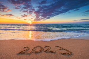 Happynewyear2023conceptletteringonthebeachwritten