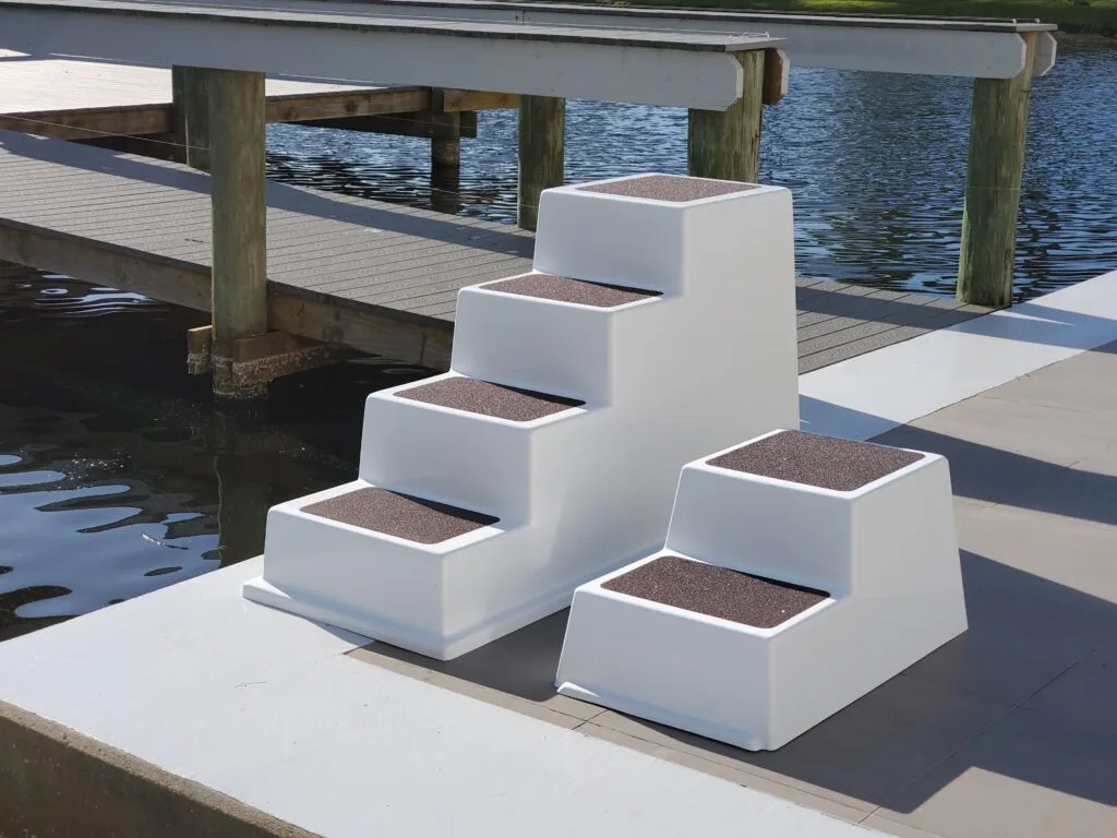 Model 400SD 4 step fiberglass dock step and model 200SD fiberglass dock step for boarding boat with sealed door front view with traction pads allows for storage inside dock step