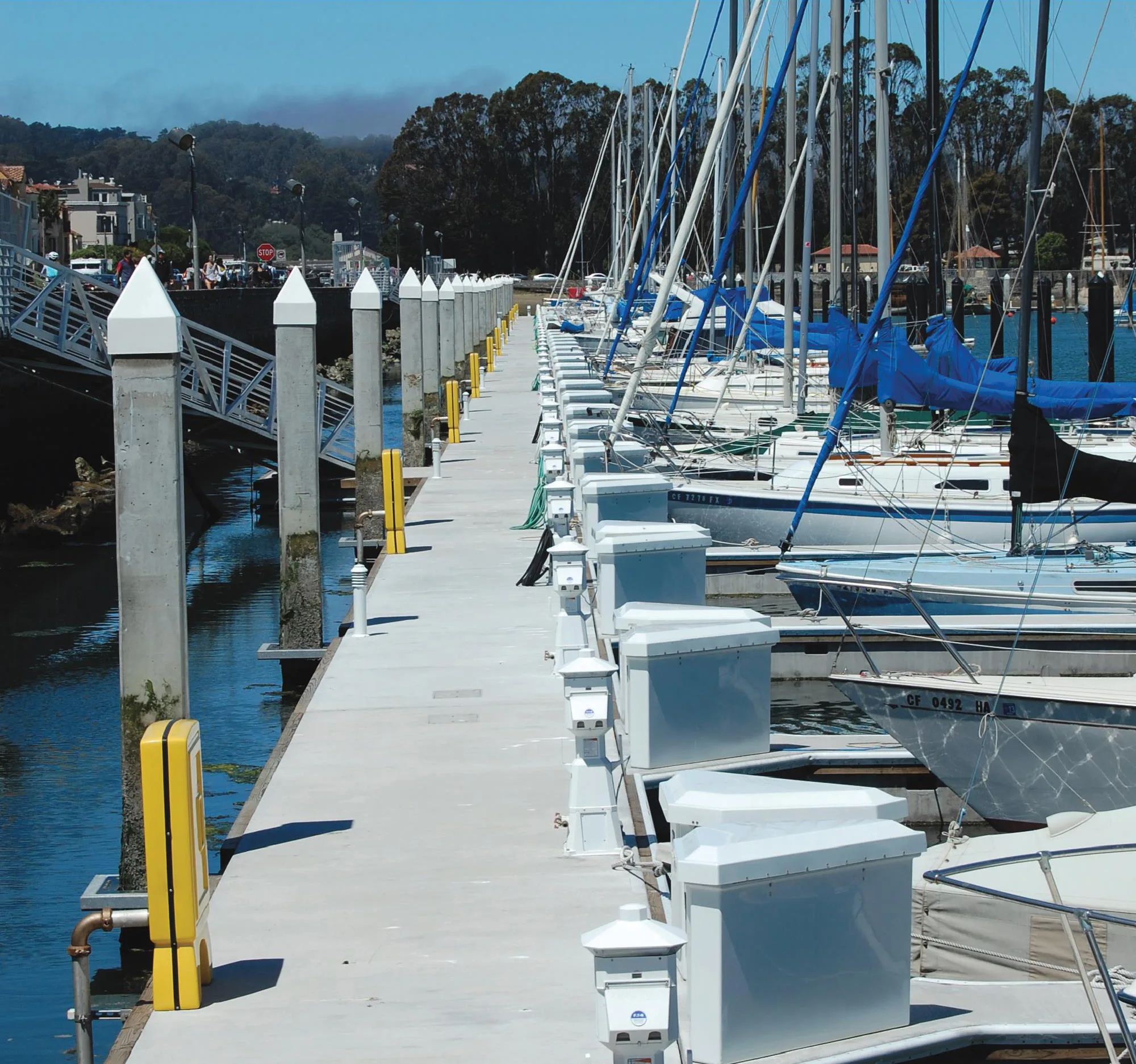Model 432 triangle dock boxes and Lighthouse Power Pedestals installed at golden gate bridge marina in San Francisco showing standardization and uniformity