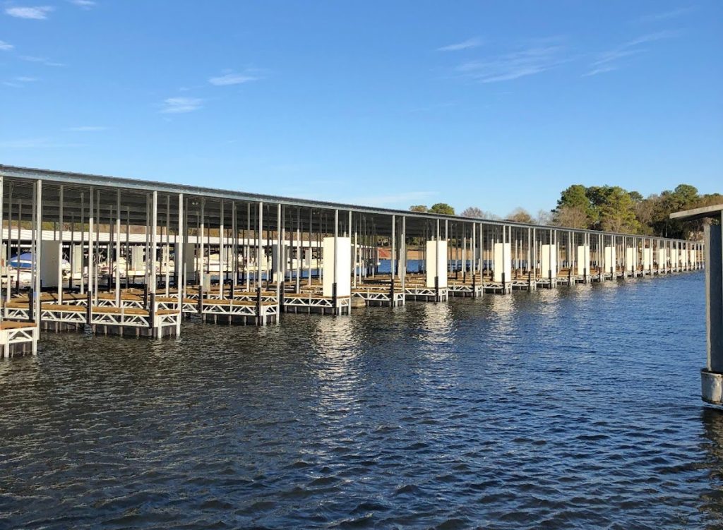 Wide angle view of a large, organized marina dock.