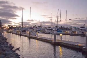 Aesthetics that elevate your dock | dock boxes unlimited inc Wide View of Marina Docks with Sun Setting Behind Boats in Background