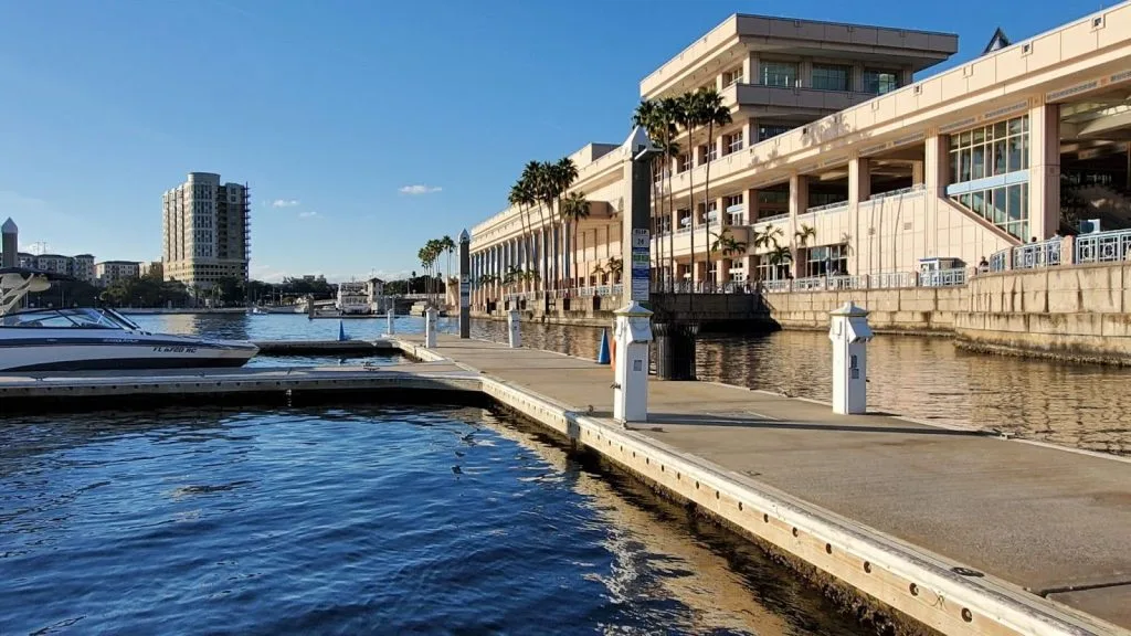 A wide angle view of shore power pedestals on marina's clean dock.