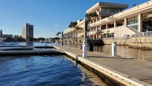 A wide angle view of shore power pedestals on marina's clean dock.