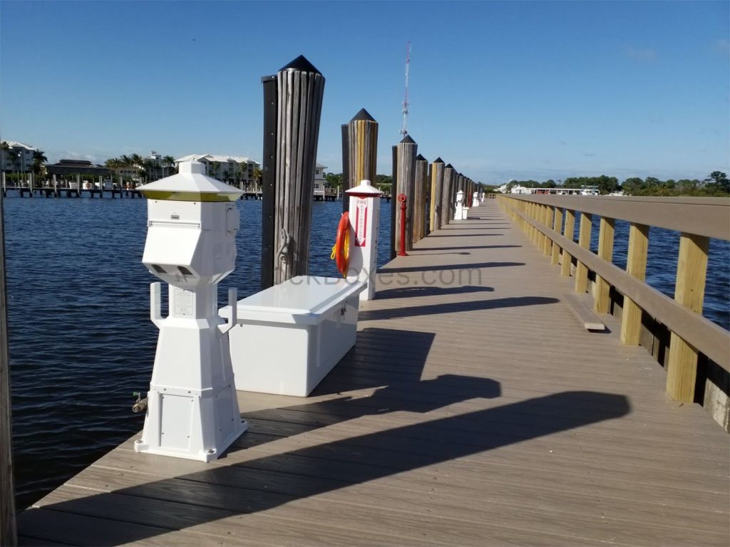 an Organized Dock on a Sunny Day with Power Pedestal Solutions and Dock Boxes