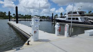 A luxury marina's dock equipped with reliable Eaton power pedestals installed by Dock Boxes Unlimited.